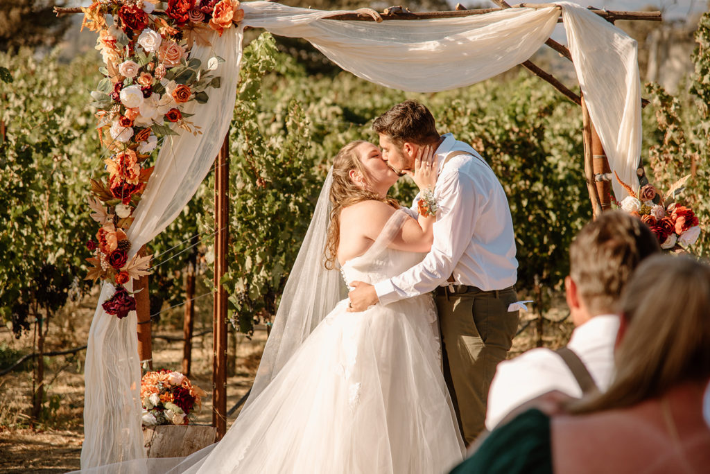 Sydney Jai Photography - Wedding ceremony, bride and groom first kiss