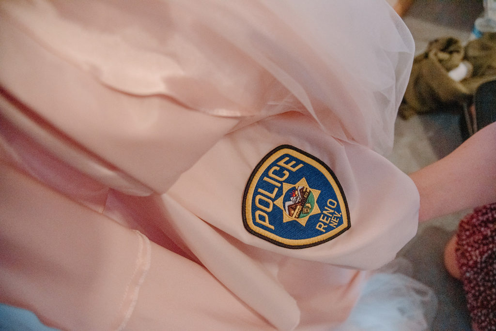 Sydney Jai Photography - police badge sewn into lining of wedding dress