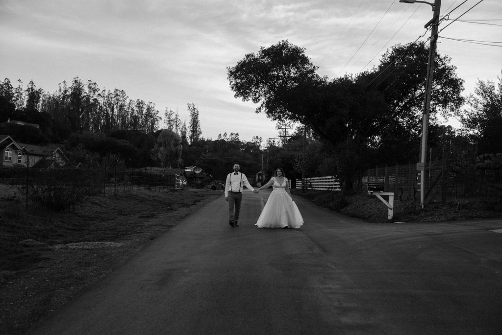Sydney Jai Photography - bride and groom photos, bride and groom holding hands and walking towards camera, black and white bride and groom photos